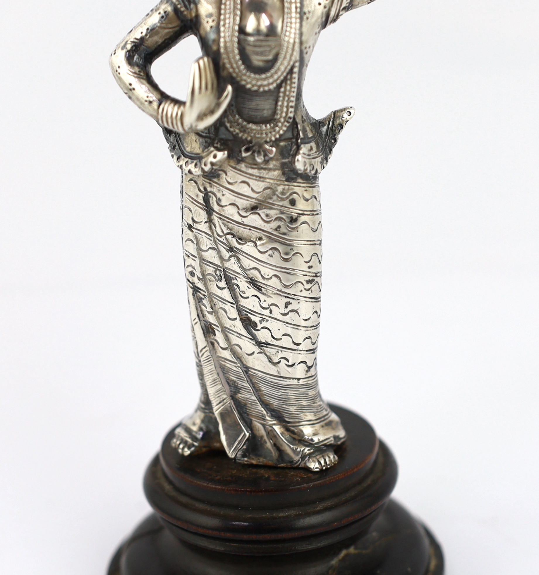A Burmese cast silver model of a dancer, late 19th century